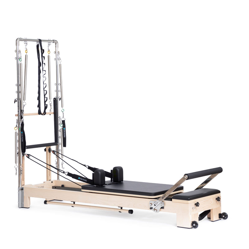Lignum Reformer with Tower in black, ropes and shoulder rests visible
