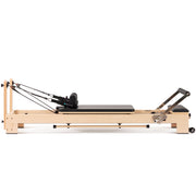 Elina Pilates Lignum Reformer side view, black upholstery